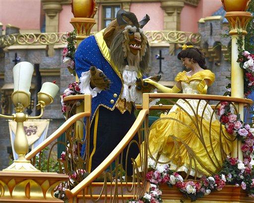 Disney characters from the movie Beauty and the  Beast, Beast and Belle, dance during a parade along Main Street at Disneyland in Anaheim, Calif. May 4, 2005. 