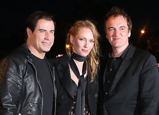 IMAGE DISTRIBUTED FOR MIRAMAX - John Travolta, Uma Thurman and Quentin Tarantino pose together ahead of the beach screening of Pulp Fiction at Miramax's 20th Anniversary celebration of the film at Majestic Beach in Cannes, southern France, during the 67th international film festival, Friday, May 23, 2014. (Photo by Joel Ryan/Invision for Miramax/AP Images)