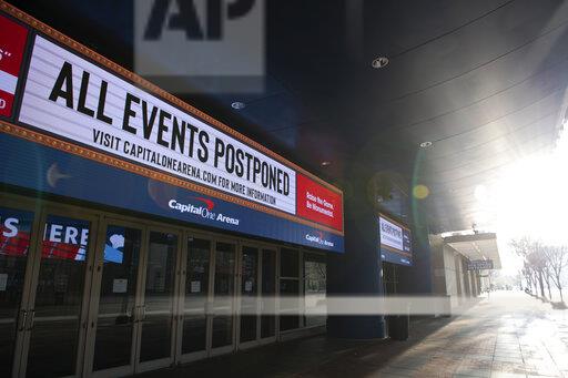  Photo courtesy of AP Images Graeme Sloan/Sipa. A general view of an illuminated sign at the Capital One Arena – where the NBAs Washington Wizards, and the NHLs Washington Capitols both play home games – that reads ALL EVENTS POSTPONED amid the ongoing COVID-19 pandemic in Washington, D.C., on March 26, 2020. 