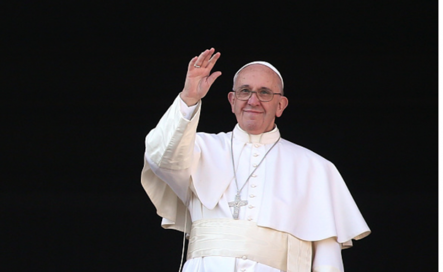 Photo courtesy of Getty Images. Pope Francis waves to the faithful as he delivers a blessing message at the Vatican. 