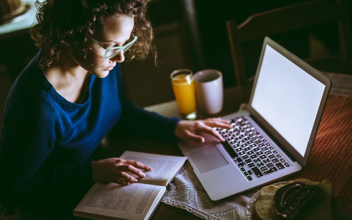 Woman studying for finals at home