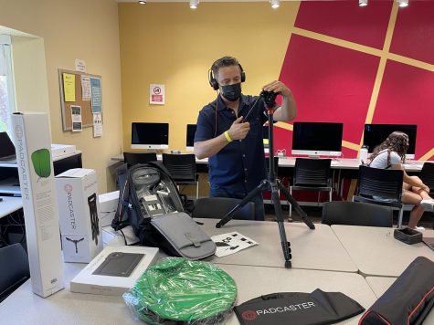 Photo courtesy of The Chaparral. Film and RTV instructor Jeff Hudson assembles new equipment for his television field production course offered spring 2022.