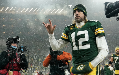 Photo courtesy of (Photo by Patrick McDermott/Getty Images. Quarterback Aaron Rodgers #12 of the Green Bay Packers gestures as he exits the field after losing the NFC Divisional Playoff game to the San Francisco 49ers at Lambeau Field on Jan. 22, 2022 in Green Bay, Wisconsin. 