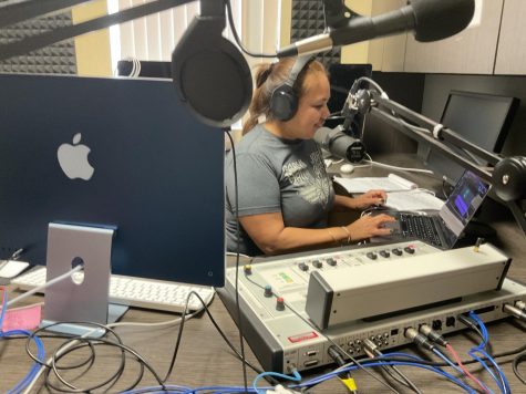 Photo courtesy of The Chaparral. IBS first place winner and award recipient, Linda Luna, working in the studio at COD Roadrunner Radio. 