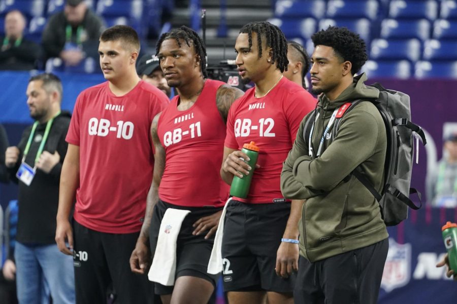 Photo courtesy of AP Images/Darron Cummings. Alabama quarterback Bryce Young, right, watches drills with Purdue quarterback Aidan OConnell, left, Florida quarterback Anthony Richardson and Ohio State quarterback CJ Stroud at the NFL football scouting combine in Indianapolis, Ind.
