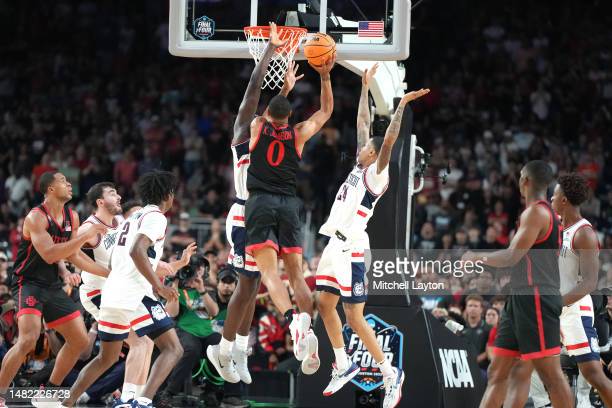 HOUSTON, TEXAS - APRIL 03: Keshad Johnson #0 of the San Diego State Aztecs drives to the basket during the NCAA Mens Basketball Tournament Final Four championship game against the Connecticut Huskies at NRG Stadium on April 03, 2023 in Houston, Texas. (Photo by Mitchell Layton/Getty Images)