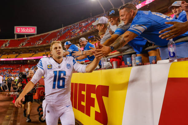 Photo Courtesy of Getty Images/ David Eulitt. Jared Goff #16 of the Detroit Lions greets visiting Lions fans following the teams 21-20 victory over the Kansas City Chiefs at GEHA Field at Arrowhead Stadium on Sept. 7, 2023 in Kansas City, Mo. 