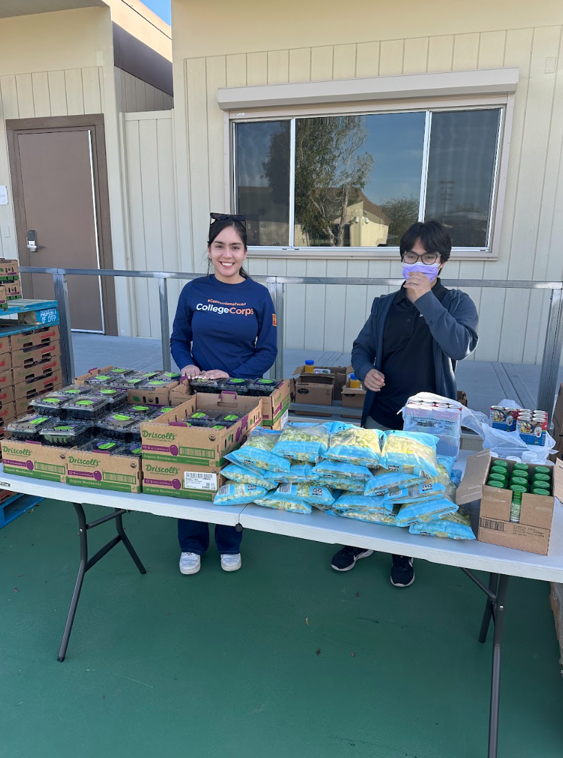 Photo courtesy of The Chaparral /Jet Bautista. College of the Desert students Maria Arcos and Pablo Guzman preparing to hand out food. 