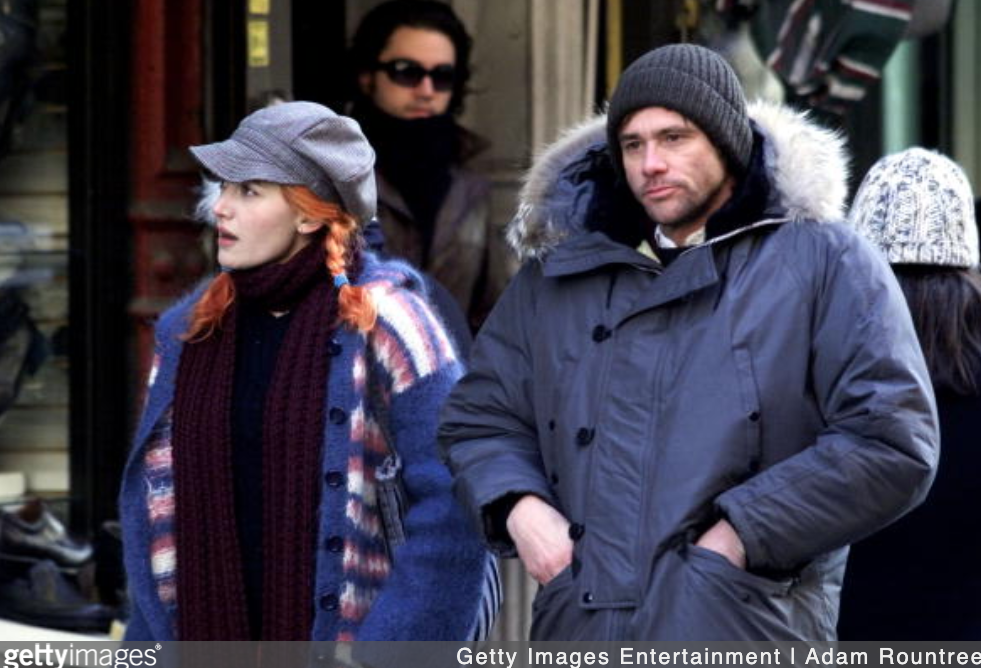 Actor Jim Carrey (R) and actress Kate Winslet stand on the movie set of "Eternal Sunshine of the Spotless Mind" January 20, 2003 in New York City. (Photo Courtesy of Adam Rountree/Getty Images)