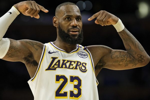 Photo courtesy of AP/William Liang. Los Angeles Lakers forward LeBron James (23) reacts after making a 3-point shot during the second half of an NBA basketball game against the Sacramento Kings, Oct. 26, 2024, in Los Angeles. 