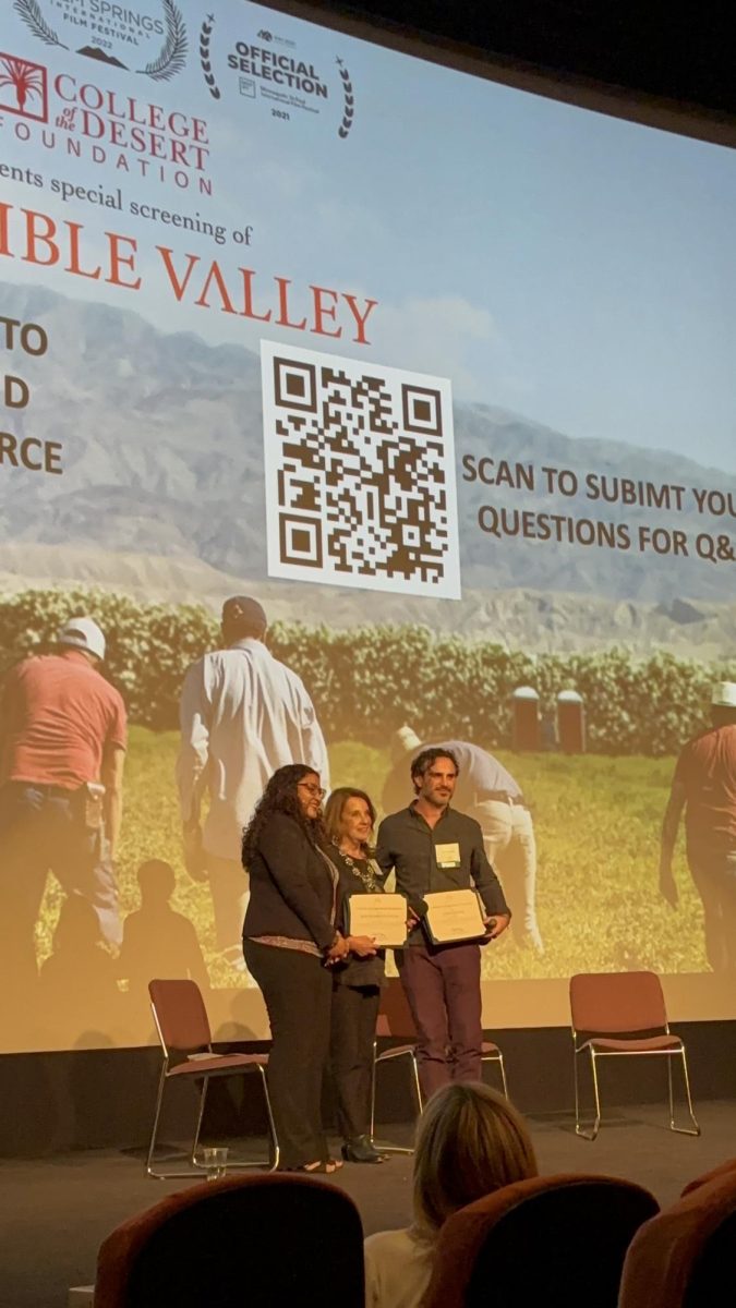 Photo courtesy of The Chaparral/Layla Freiberg. Shayra Hernandez presenting an award to Director Aaron Maurer and Executive Producer Mary Ingebrand-Pohlad after the screening. 