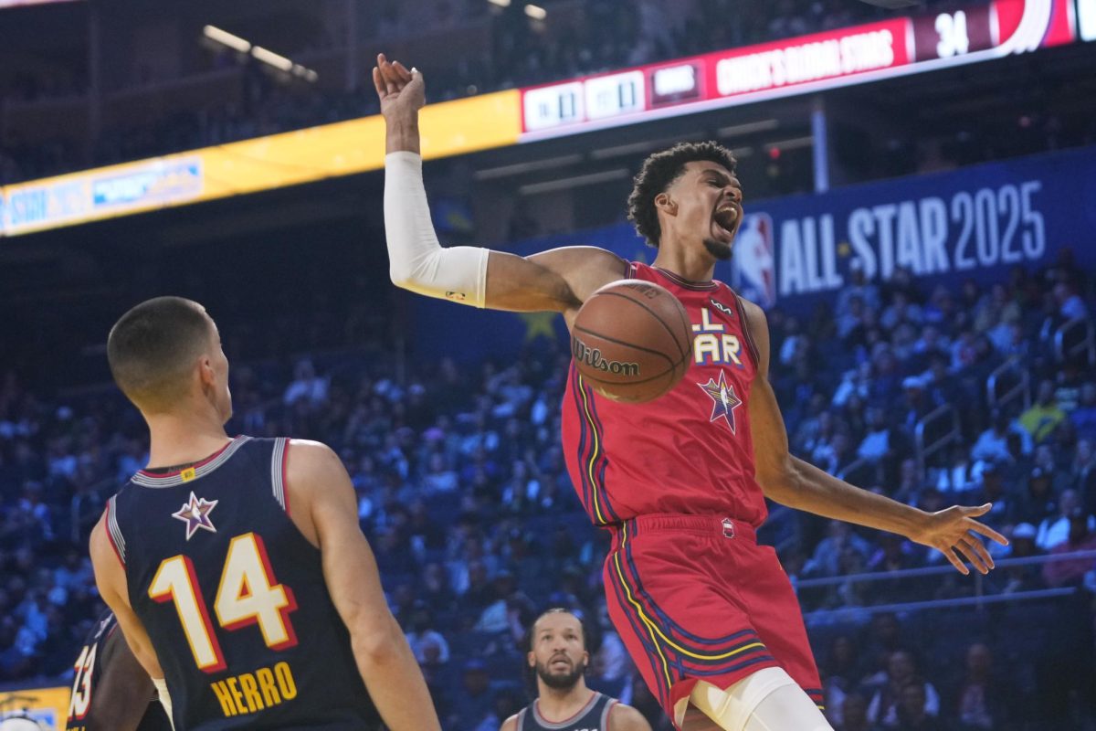 Photo courtesy of AP Photo/Godofredo A. Vásquez. The San Antonio Spurs center Victor Wembanyama dunks past Miami Heat guard Tyler Herro during the NBA All-Star basketball game Feb. 16, 2025, in San Francisco.