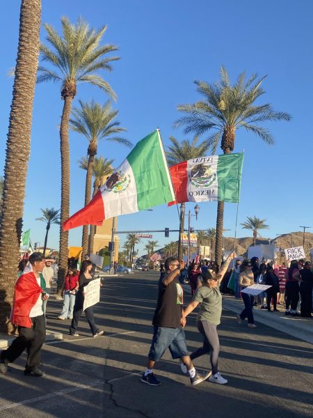 Photo Courtesy of The Chaparral/Brenda Vargas. Protestors in Cathedral City wave Mexican flags. 