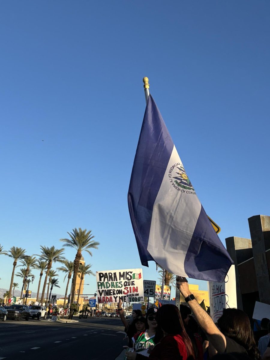 Photo courtesy of The Chaparral/Layla Freiberg. Protestors in Cathedral City march across from the Mary Pickford Theater. 