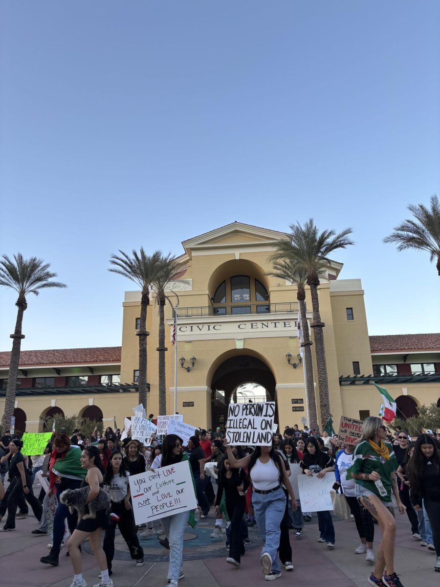 Photo courtesy of The Chaparral/Layla Freiberg. Protestors dancing to "Payaso de Rodeo" by Caballo Dorado in front of the Cathedral City Civic Center. 