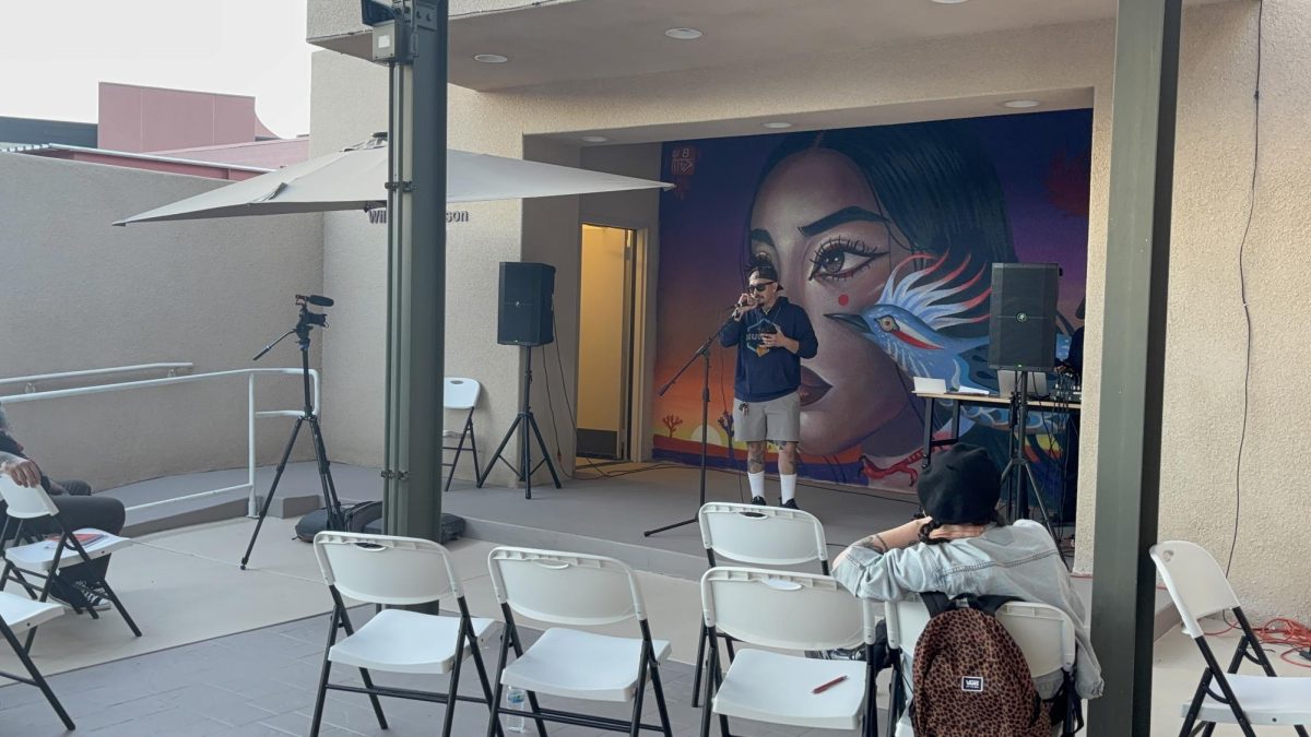 Photo courtesy of The Chapparal/Layla Freiberg. Giovanni Host freestyling at the open mic night. 