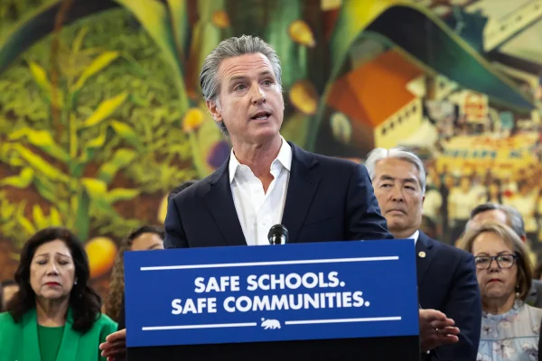 Photo courtesy AP Images/Ted Soquil. Gov. Gavin Newsom signed laws restricting the Trump administration's immigration enforcement tactics in Los Angeles on Sept. 20, 2025.

