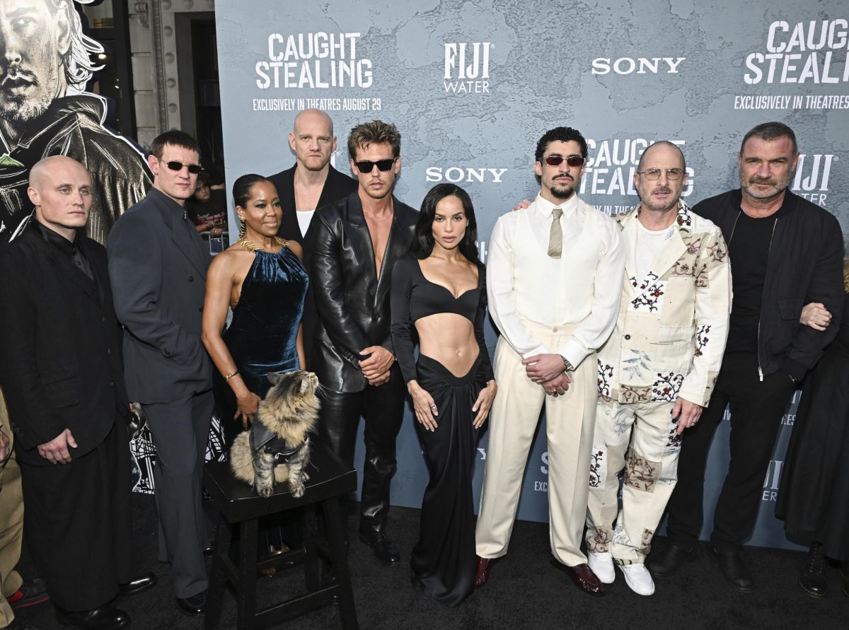 Photo courtesy of Evan Agostini/Invision/AP — Nikita Kukushkin, from left, Matt Smith, Regina King, Yuri Kolokolnikov, Austin Butler, Zoë Kravitz, Benito Antonio Martínez Ocasio (aka Bad Bunny), Darren Aronofsky, and Liev Schreiber attend the premiere of "Caught Stealing" at Regal Union Square on Tuesday, Aug. 26, 2025, in New York.