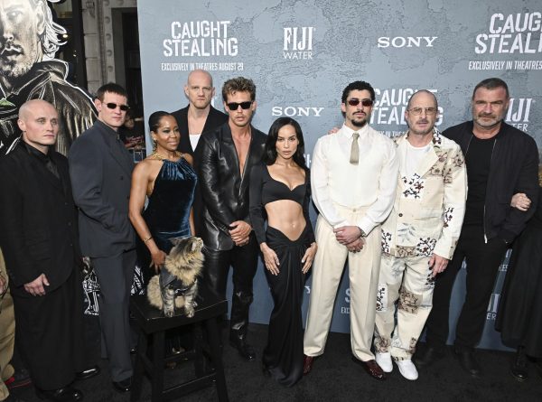 Photo courtesy of Evan Agostini/Invision/AP — Nikita Kukushkin, from left, Matt Smith, Regina King, Yuri Kolokolnikov, Austin Butler, Zoë Kravitz, Benito Antonio Martínez Ocasio (aka Bad Bunny), Darren Aronofsky, and Liev Schreiber attend the premiere of "Caught Stealing" at Regal Union Square on Tuesday, Aug. 26, 2025, in New York.