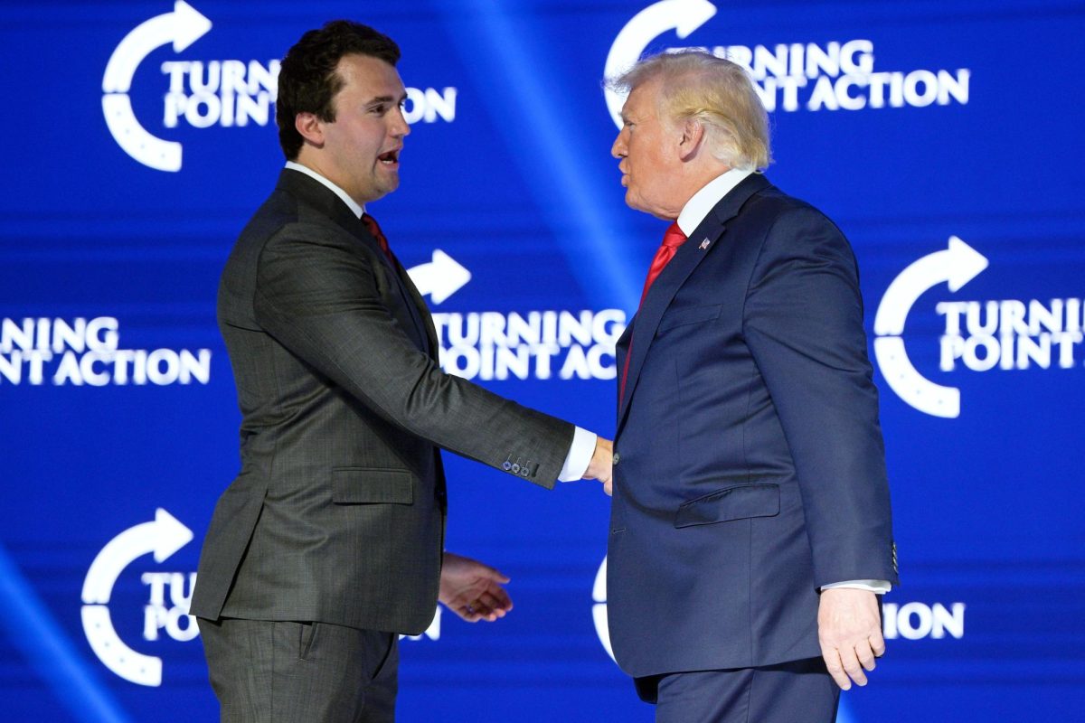 Photo courtesy of AP/Phelan M. Ebenhack, File – Former President Donald Trump, right, shakes hands with Turning Point CEO Charlie Kirk before speaking at the Turning Point USA Student Action Summit on July 23, 2022, in Tampa, Fla. The Nebraska Republican Party, led by Trump loyalists, will hold a rally on Tuesday, April 9, 2024, in Omaha, featuring Kirk to address the state’s system of splitting its five presidential electoral votes by congressional district.