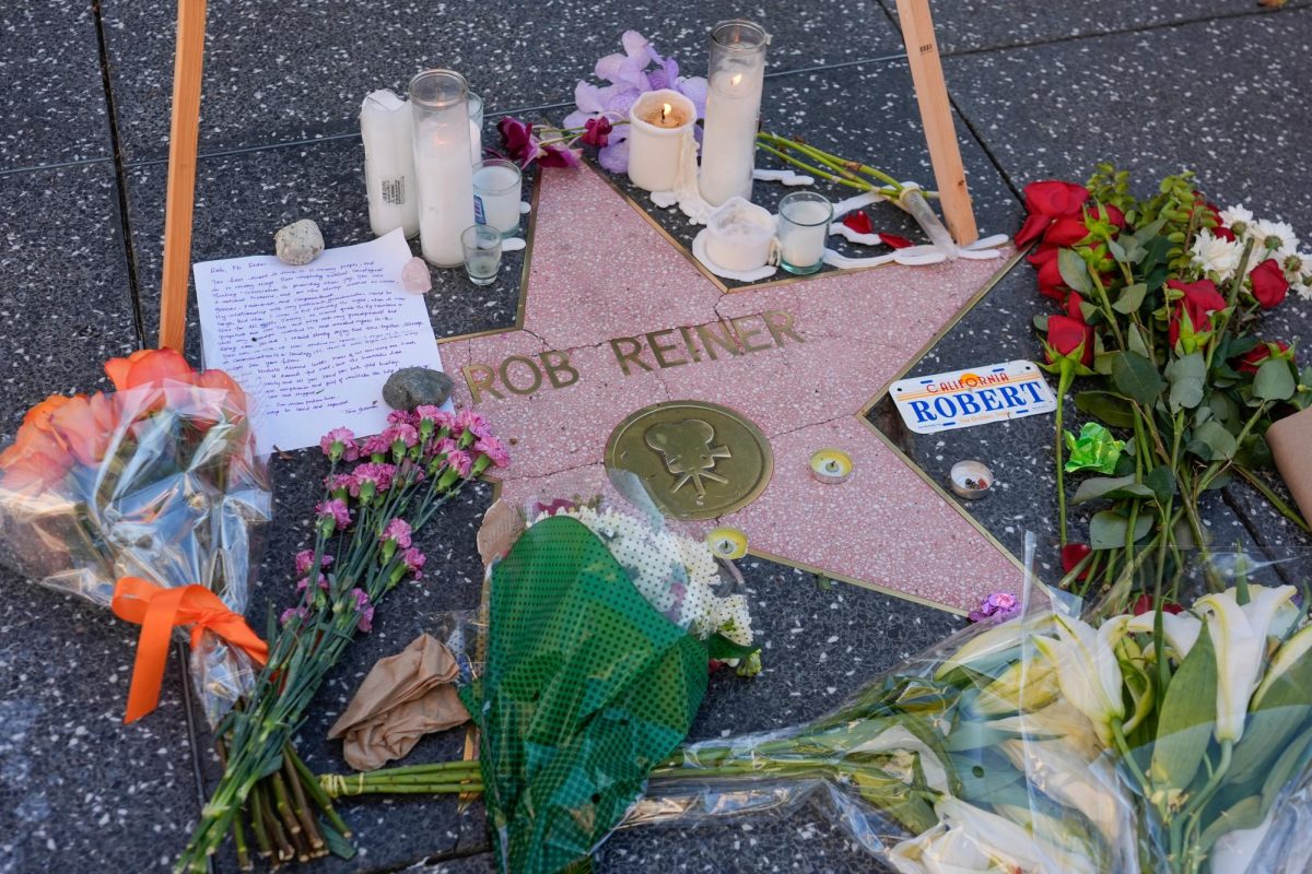 Photo courtesy of AP/Chris Pizzello. Flowers and candles are placed on the Walk of Fame star for Rob Reiner on Dec. 16, 2025, in Los Angeles.