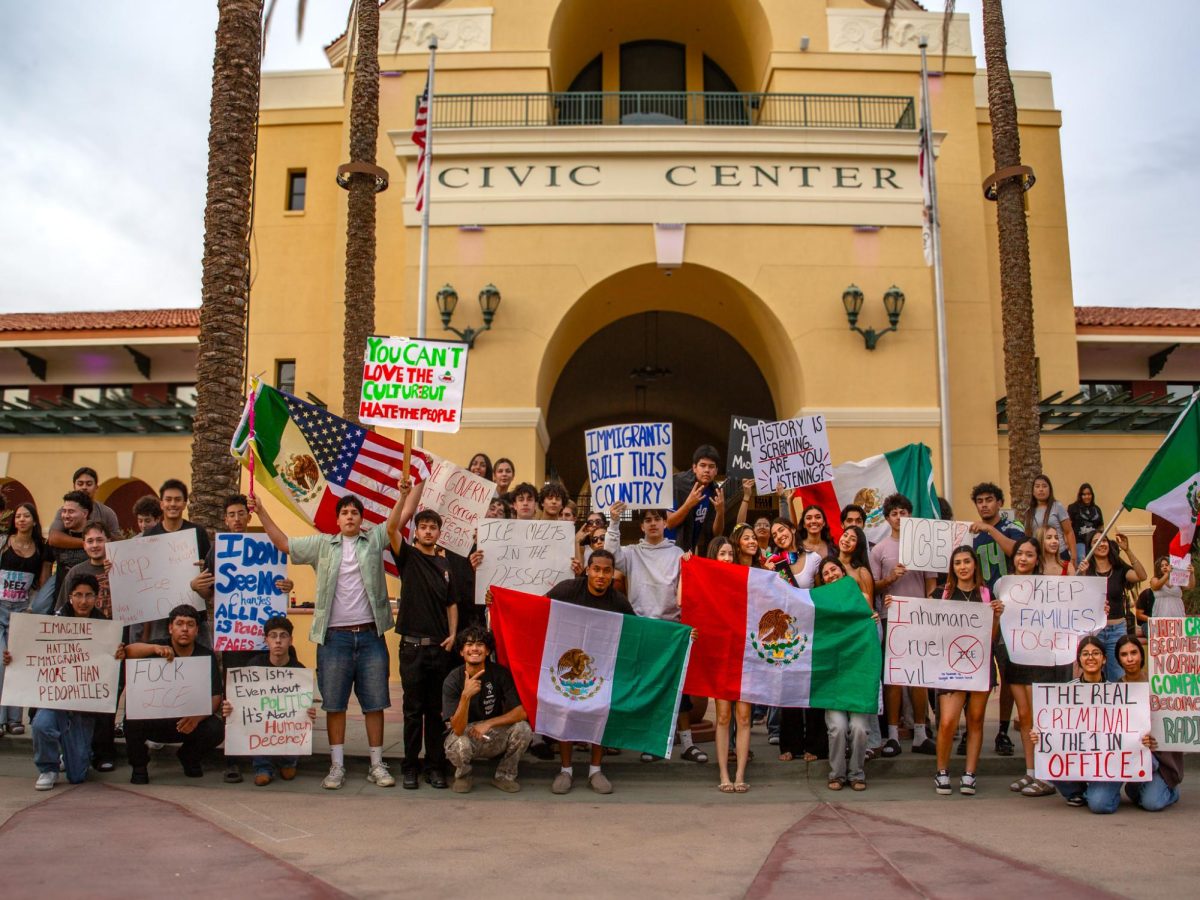 Photo courtesy of The Chaparral/ Kailey Diaz. College of the Desert at the Monterey Entrance. Rancho Mirage and Cathedral City High School students meet at Cathedral City Civic Center with flags and signs.