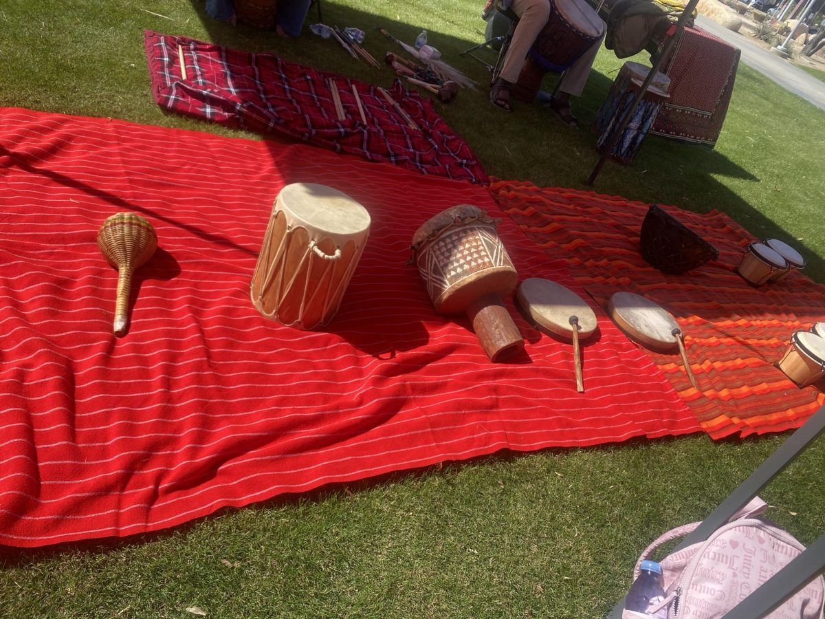 Photo courtesy of The Chaparral / Isabel Colin. Oneko Arika leads a drumming session with crowd participation at College of the Desert. 