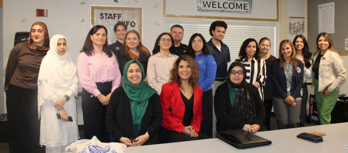 Photo courtesy of Human Migration Institute. President/Founder Dr. Selin Nielsen (In Red), among other members of the Human Migration Institute. 