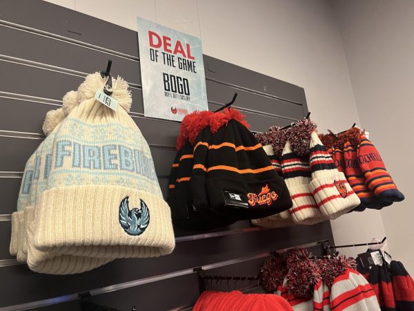 Firebirds beanies below a sign that reads "Deal of the Game. BOGO Buy 1, Get 1 50% off"