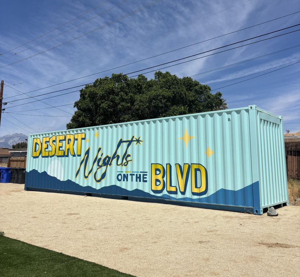 Photo courtesy of The Chaparral/Keira Davidson. Shipping container decorated with the words "Desert Nights on the BLVD"